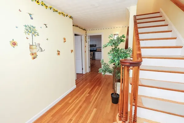 a view of entryway with wooden floor