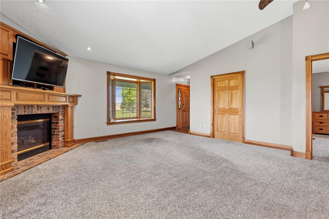 4971 Lackey Road Cedarville, OH 45314 - Photo 49 of 79 This inviting living space features a cozy fireplace and abundant natural light.