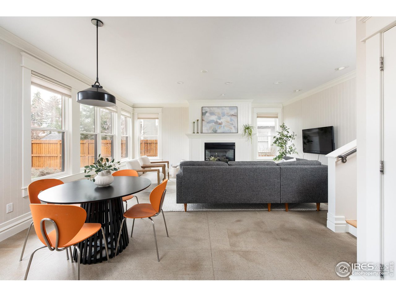 721 Concord Avenue Boulder, CO 80304 - Photo 13 of 40 a living room with furniture a fireplace and a flat screen tv