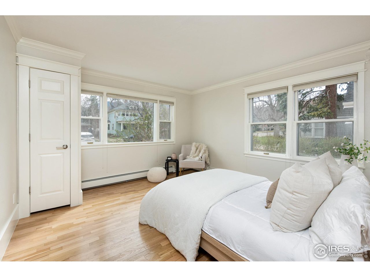 721 Concord Avenue Boulder, CO 80304 - Photo 17 of 40 a bedroom with a bed and wooden floor