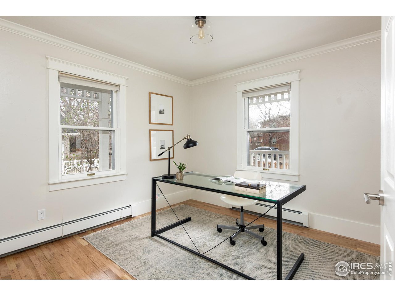 721 Concord Avenue Boulder, CO 80304 - Photo 19 of 40 a view of a workspace with wooden floor and a window
