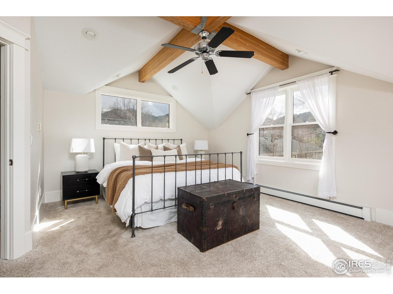 721 Concord Avenue Boulder, CO 80304 - Photo 20 of 40 a living room with a bed furniture and a window