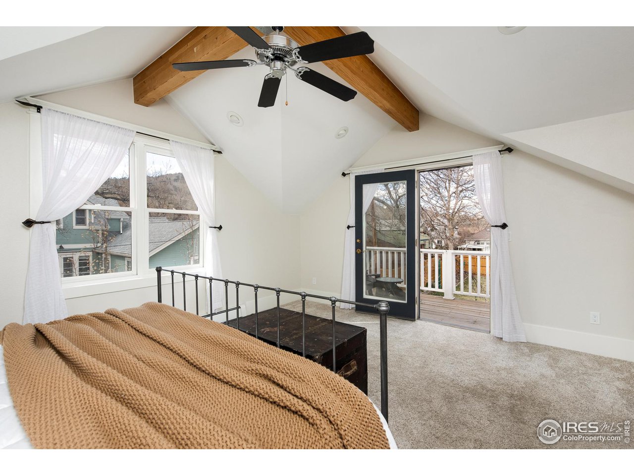 721 Concord Avenue Boulder, CO 80304 - Photo 22 of 40 a bedroom with a bed and a large window