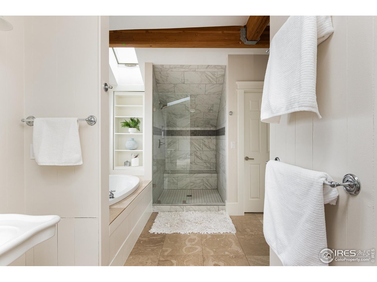 721 Concord Avenue Boulder, CO 80304 - Photo 24 of 40 a bathroom with a tub shower and sink