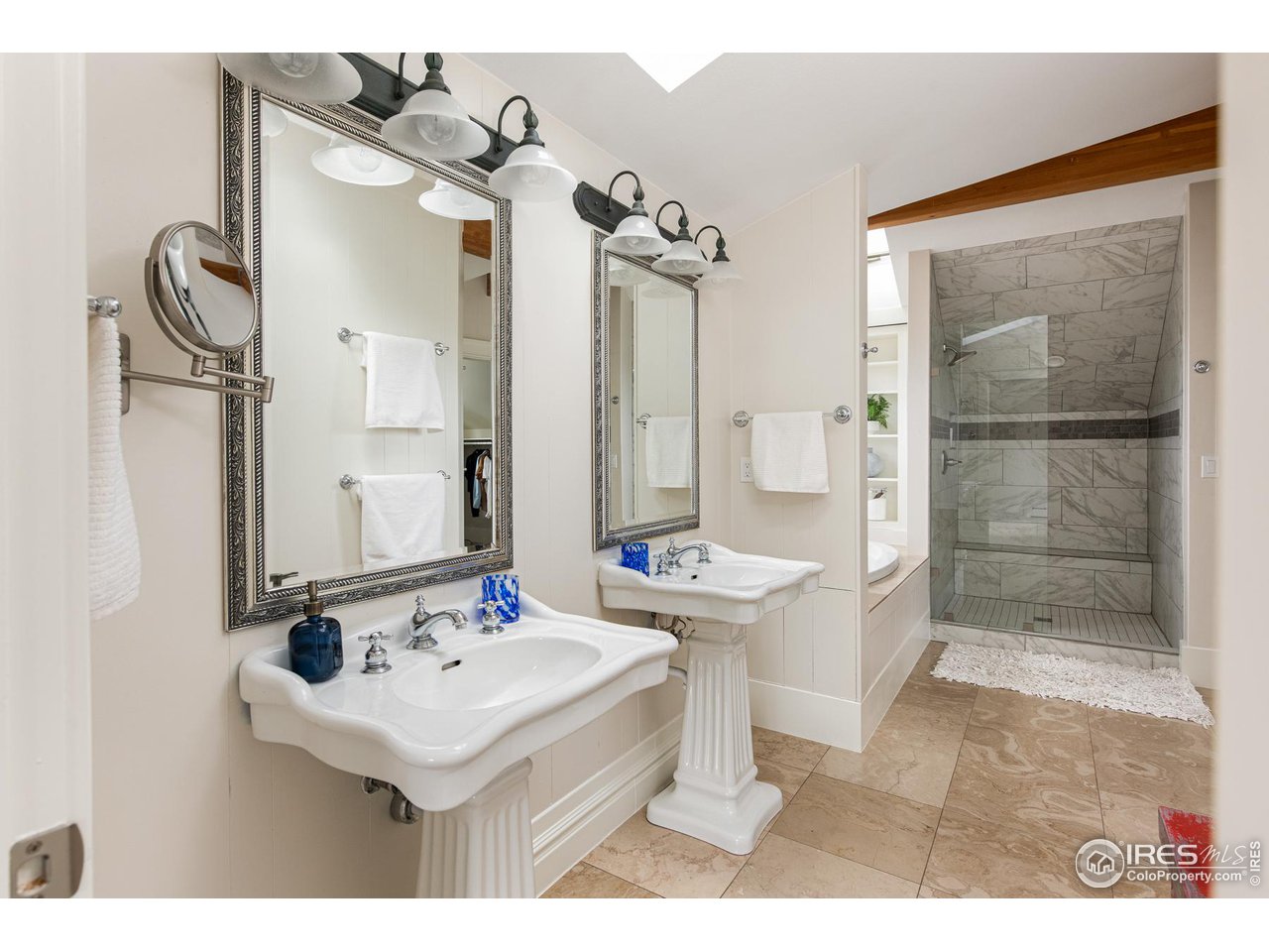 721 Concord Avenue Boulder, CO 80304 - Photo 25 of 40 a bathroom with a sink mirror and a shower
