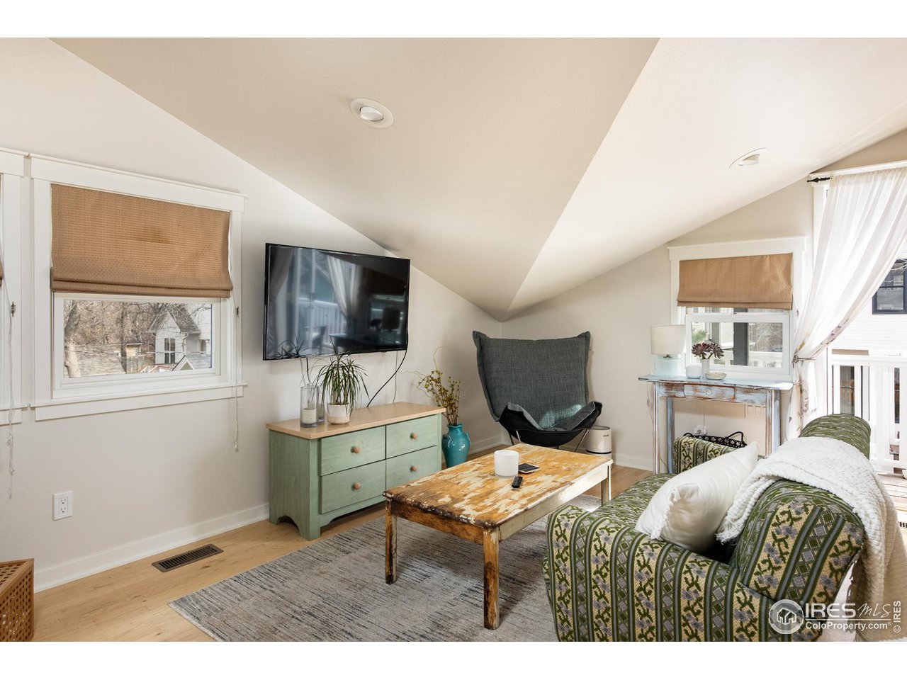 721 Concord Avenue Boulder, CO 80304 - Photo 31 of 40 a living room with furniture flat screen tv and window