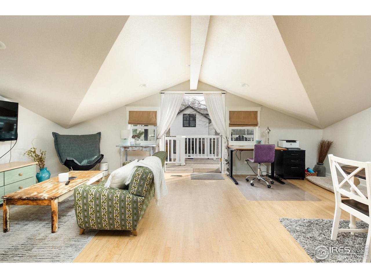 721 Concord Avenue Boulder, CO 80304 - Photo 32 of 40 a bedroom with furniture and a chair