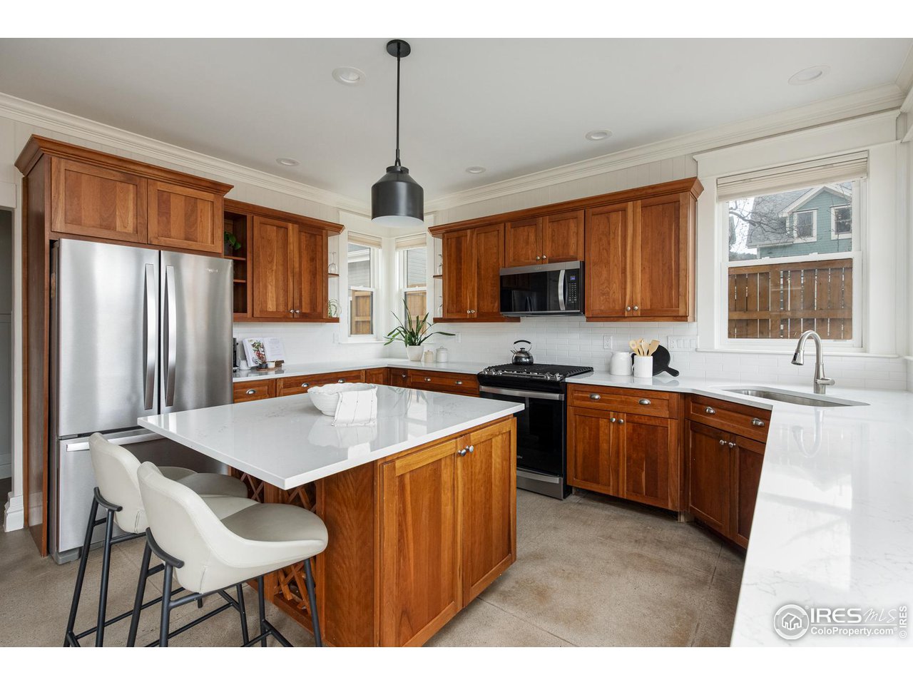 721 Concord Avenue Boulder, CO 80304 - Photo 10 of 40 a kitchen with stainless steel appliances granite countertop a sink stove and refrigerator