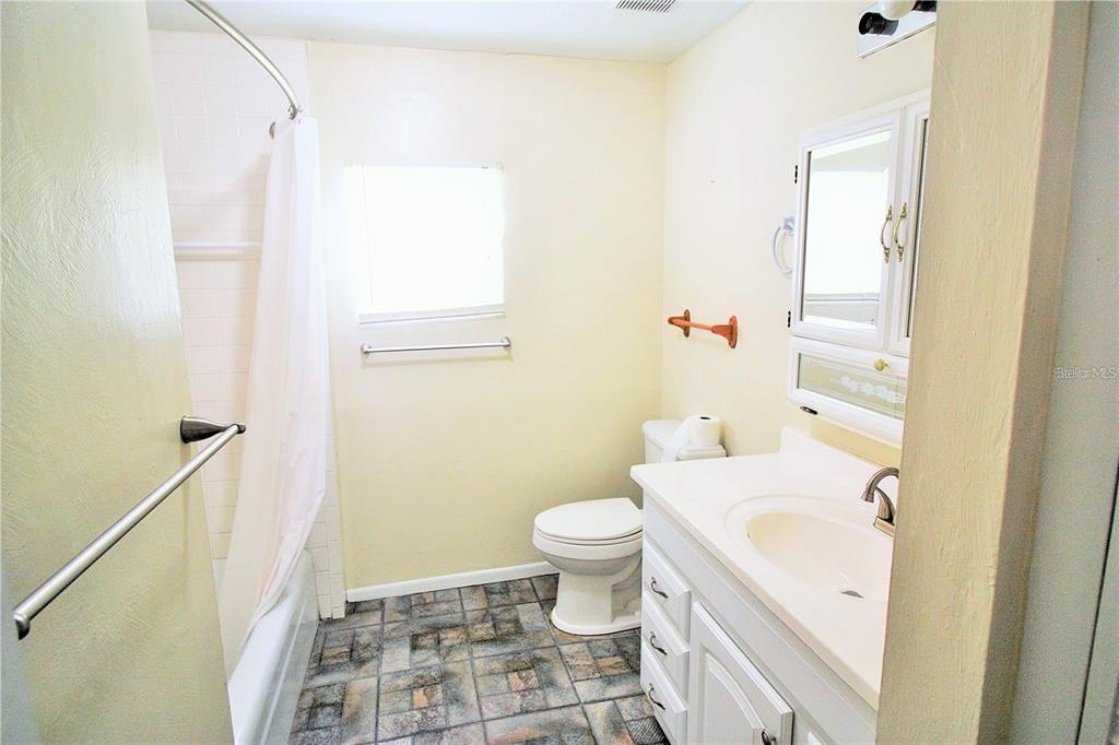 521 20th Street Southwest, Unit C Winter Haven, FL 33880 - Photo 10 of 18 a bathroom with a sink toilet and shower