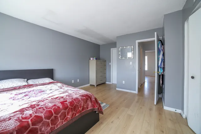 a bedroom with a bed and a table