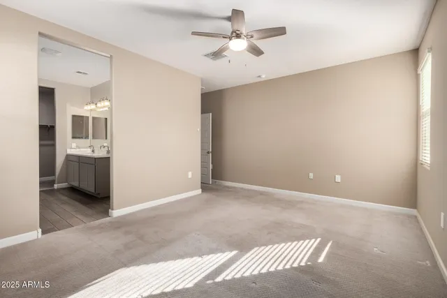 a view of livingroom with hardwood floor and a ceiling fan