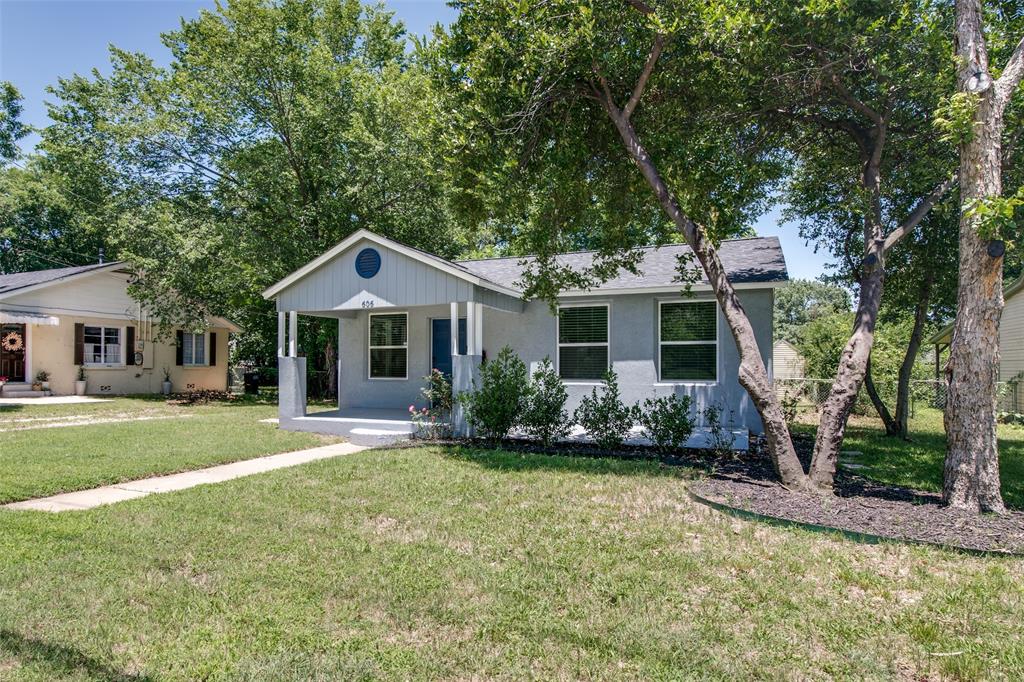 606 West High Street Terrell, TX 75160 - Photo 3 of 28 a front view of a house with a yard and garage