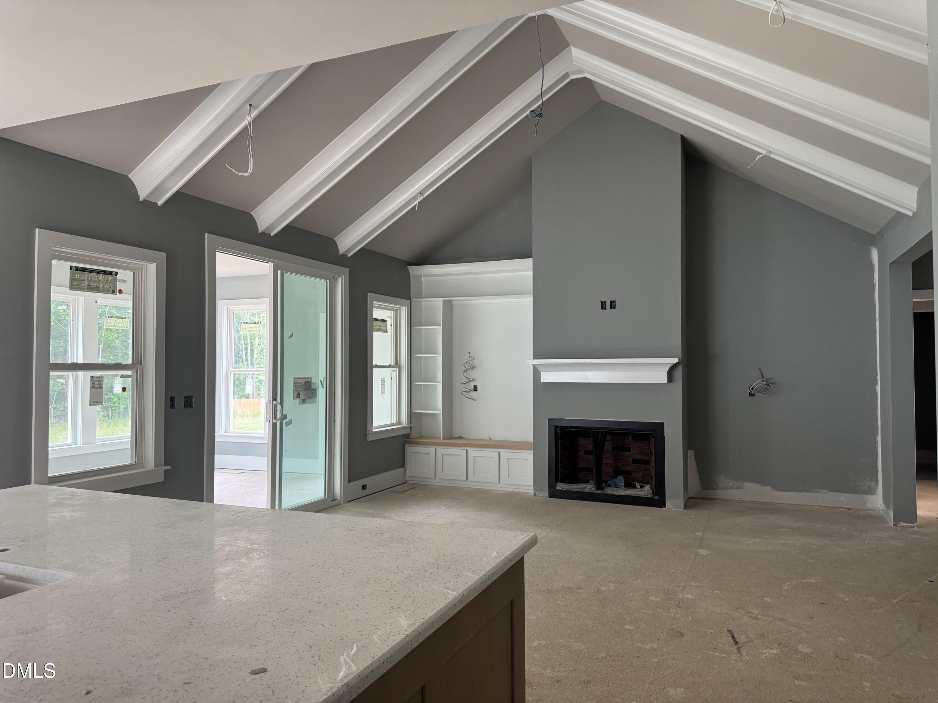 935 Lynch Road Selma, NC 27576 - Photo 7 of 21 a view of a livingroom with an empty space and a fireplace