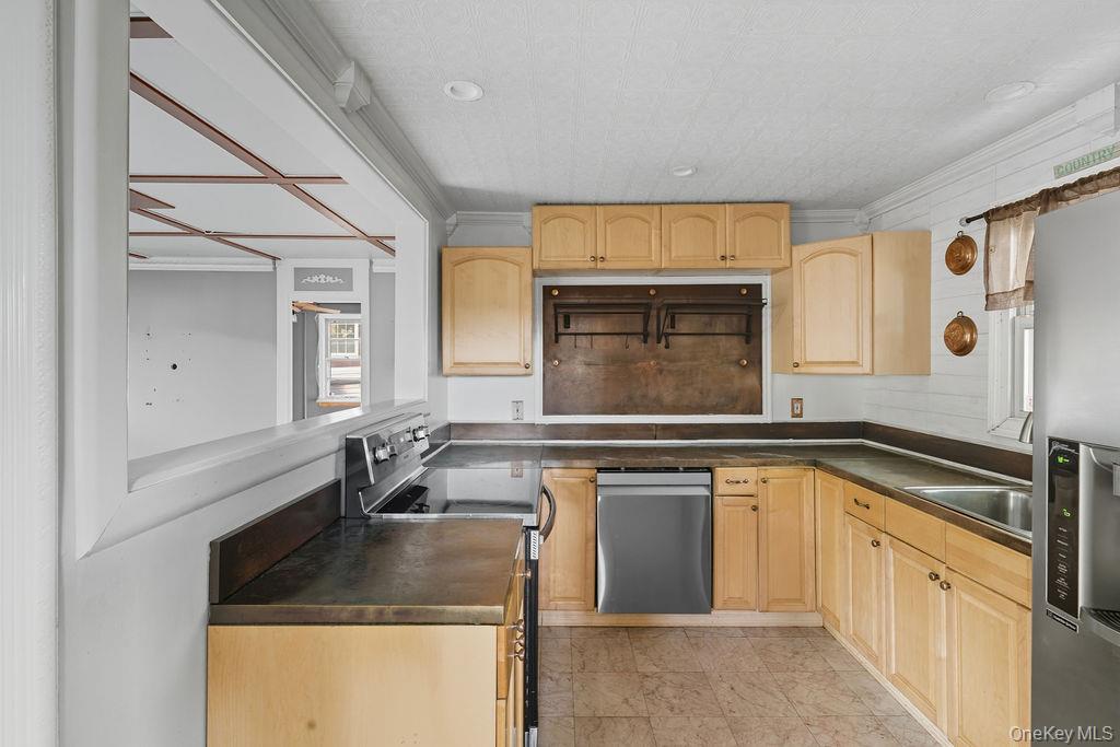 230 Lakeside Trail Ridge, NY 11961 - Photo 12 of 33 a kitchen with granite countertop a sink and cabinets