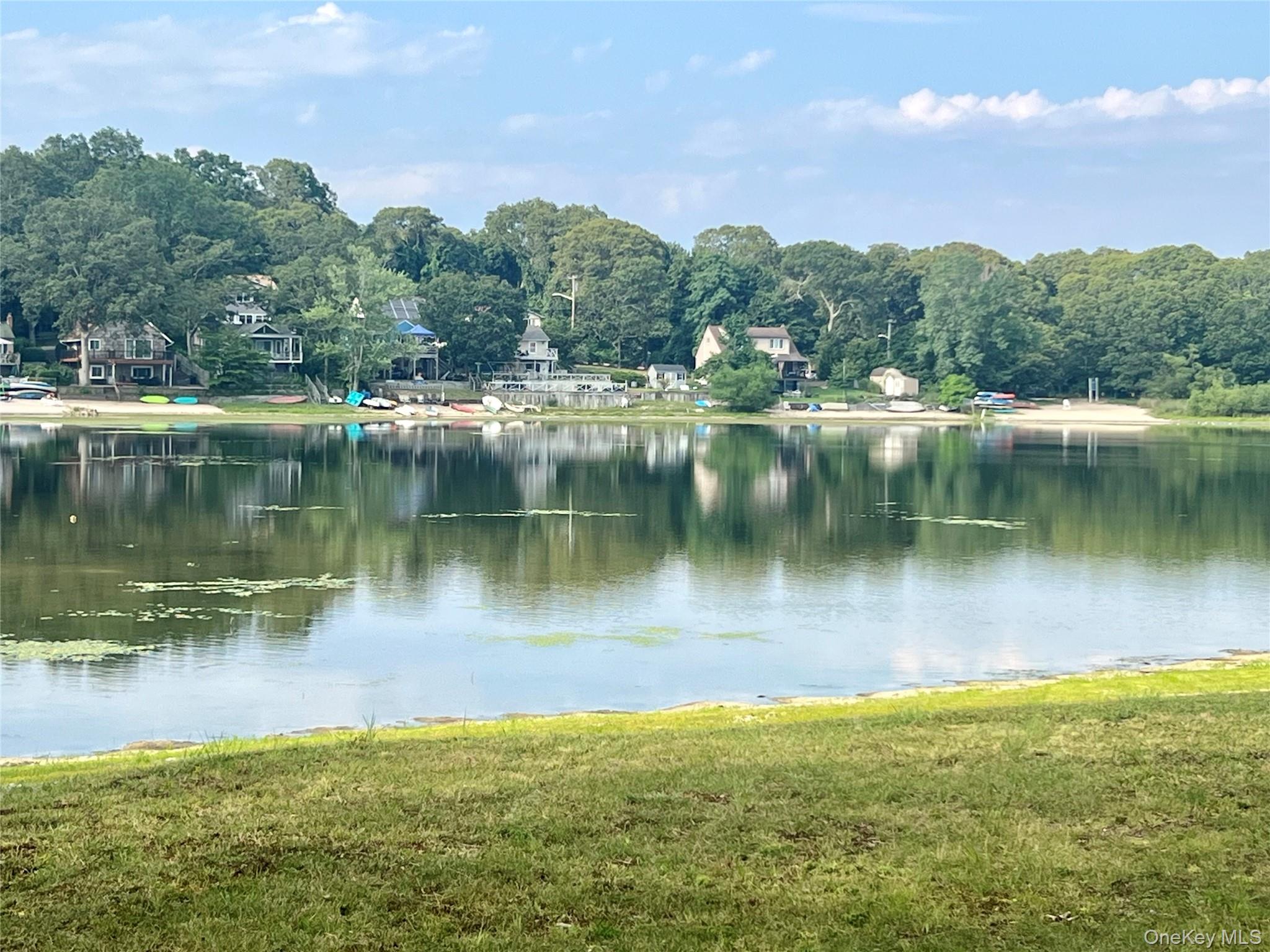 230 Lakeside Trail Ridge, NY 11961 - Photo 23 of 33 a view of a lake