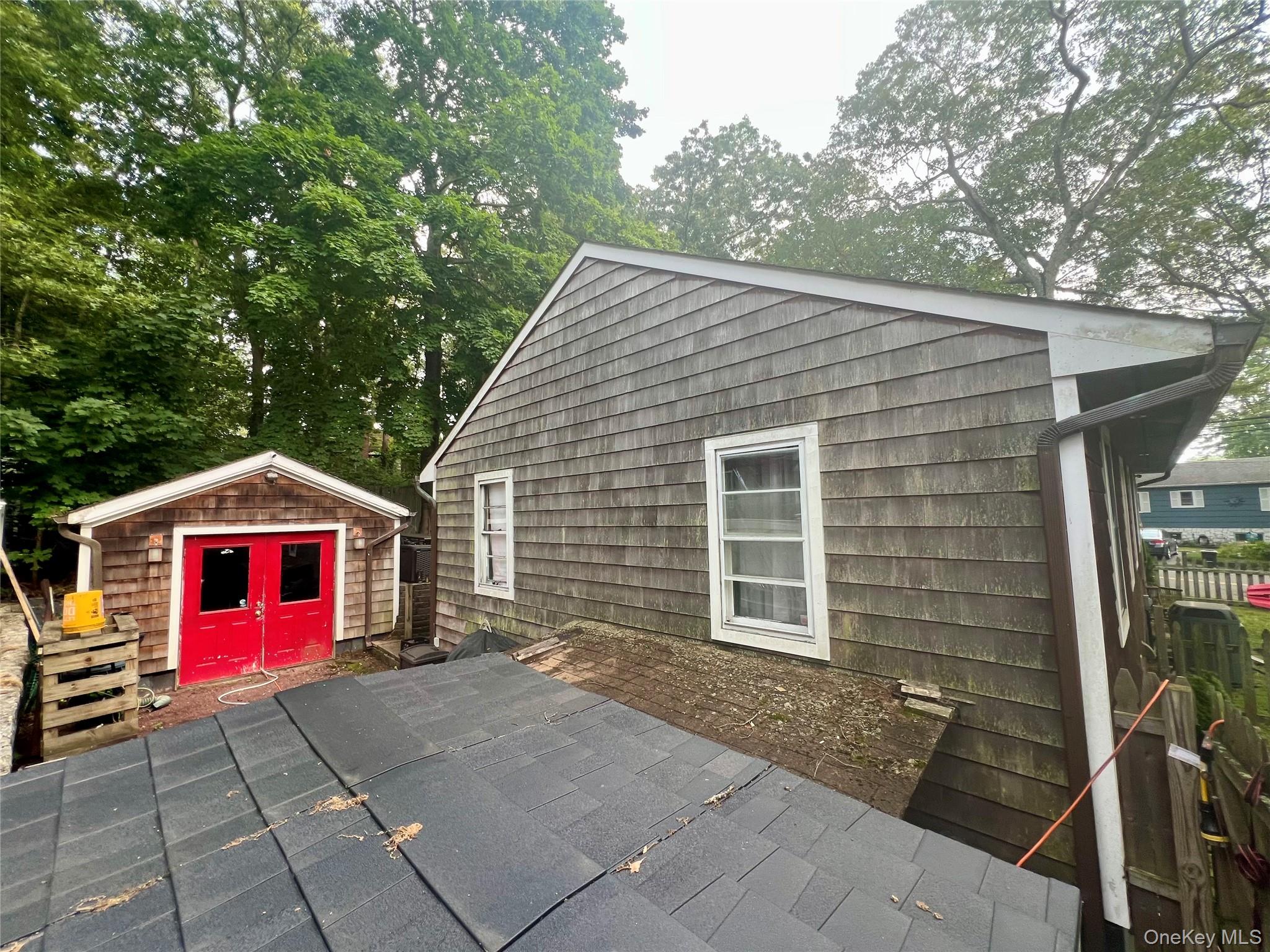 230 Lakeside Trail Ridge, NY 11961 - Photo 3 of 33 a view of a house with a yard and garage