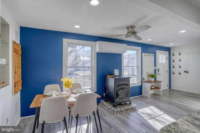 a bedroom with a large bed and a potted plant