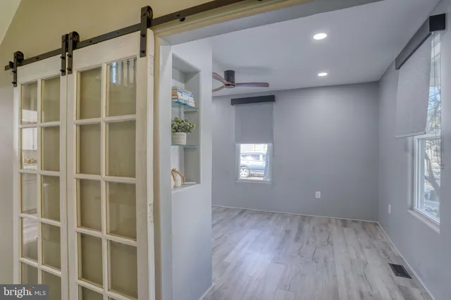 a view of an empty room with a window