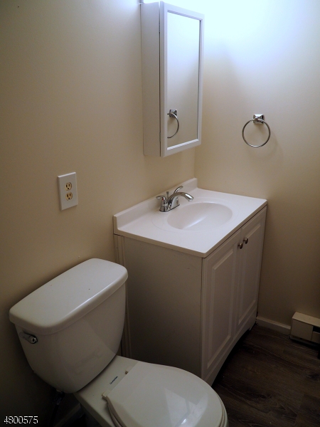 41 Canal Street Landing, NJ 07850 - Photo 11 of 20 a bathroom with a toilet sink and mirror