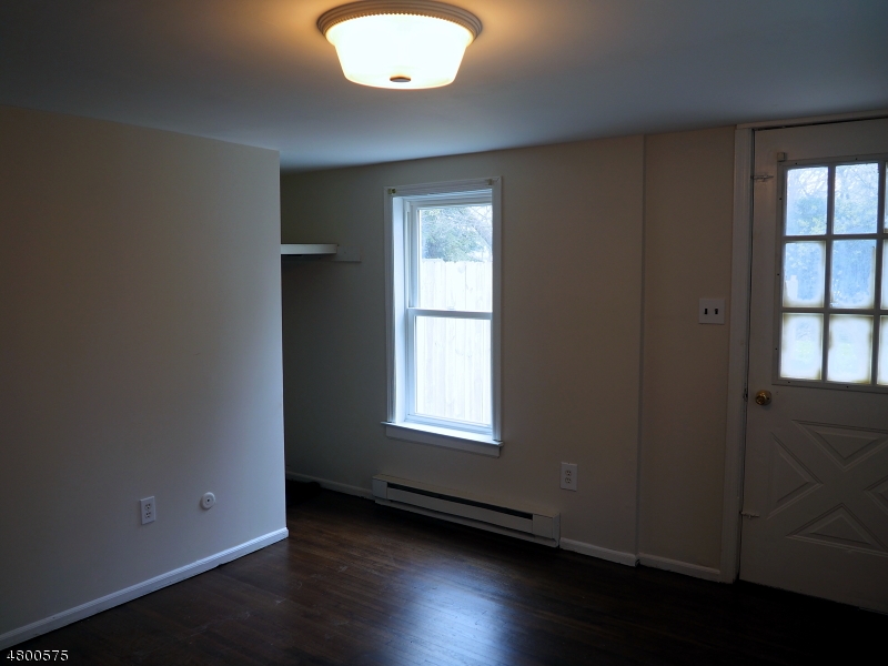 41 Canal Street Landing, NJ 07850 - Photo 15 of 20 an empty room with wooden floor and windows