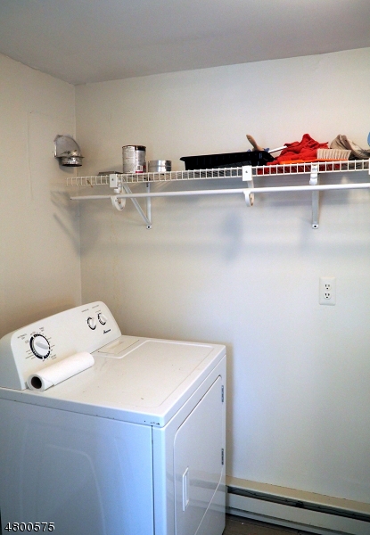 41 Canal Street Landing, NJ 07850 - Photo 18 of 20 a utility room with an empty shelf dryer and washer