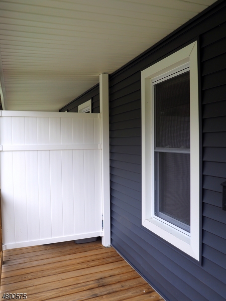 41 Canal Street Landing, NJ 07850 - Photo 2 of 20 a view of an empty room with wooden floor and a window