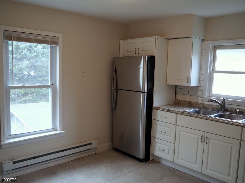 41 Canal Street Landing, NJ 07850 - Photo 5 of 20 a kitchen with appliances cabinets and a window