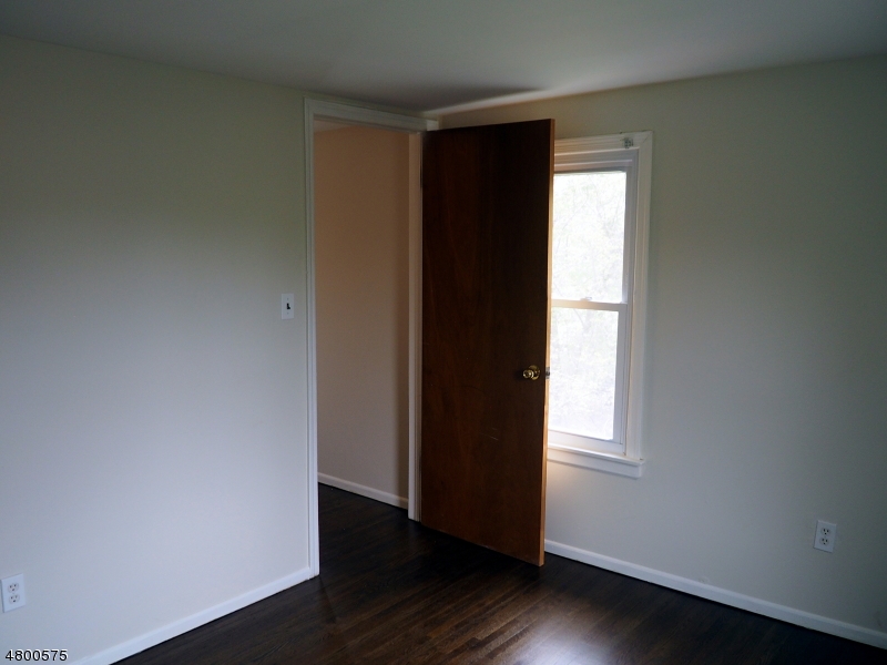 41 Canal Street Landing, NJ 07850 - Photo 7 of 20 an empty room with wooden floor and closet