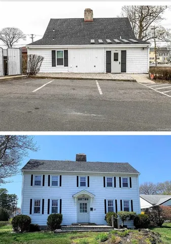 a view of house with a yard