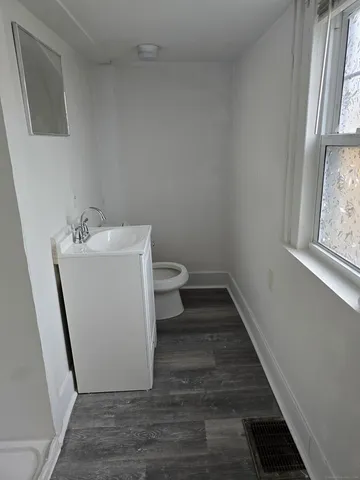 a bathroom with sink and mirror