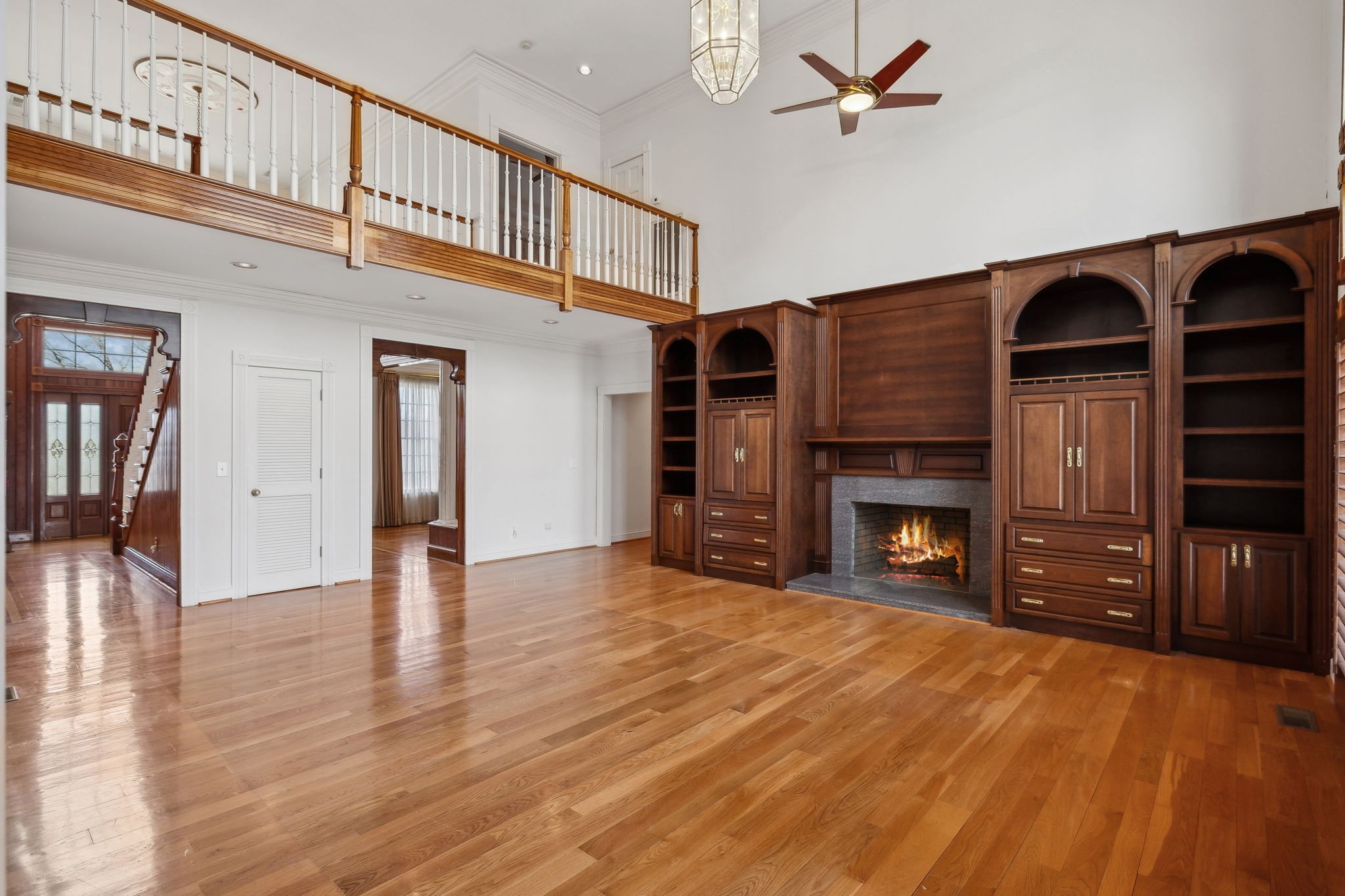 5090 Main Street Spring Hill, TN 37174 - Photo 23 of 91 a view of an empty room with wooden floor fireplace and a window