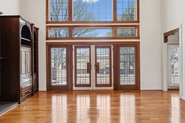 a workspace with wooden floor and furniture