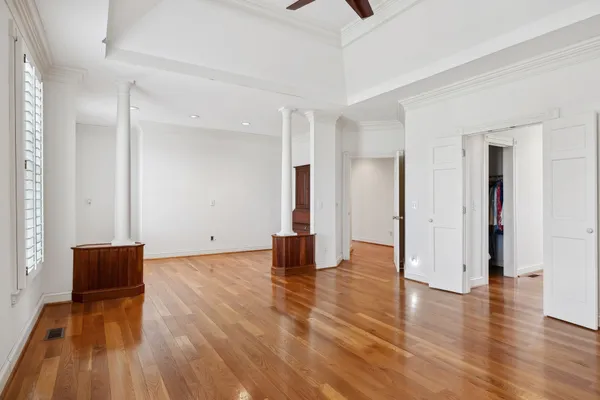 a kitchen with stainless steel appliances granite countertop wooden floors and wooden cabinets