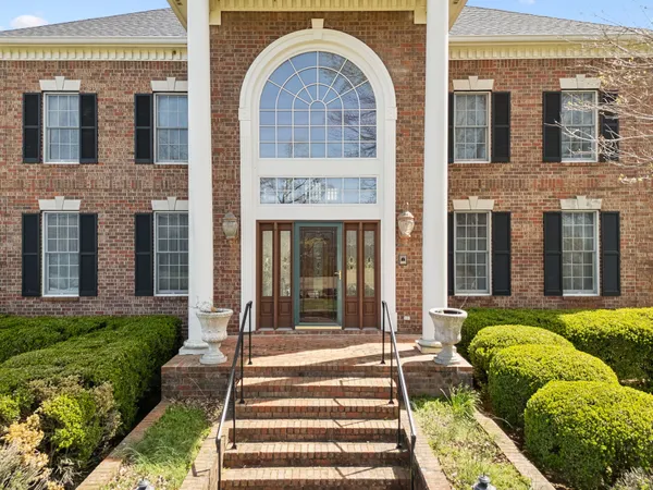 a view of an entryway with a floor to ceiling window
