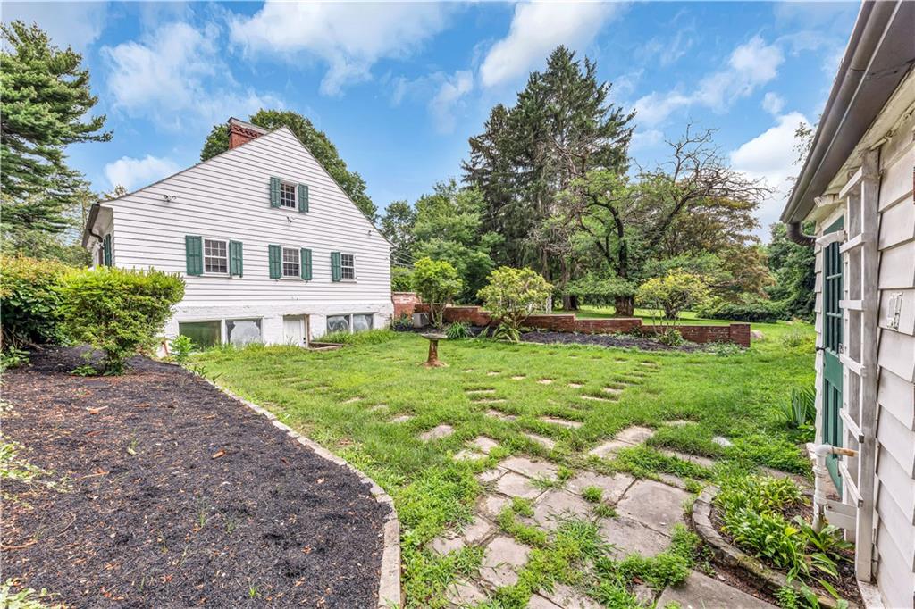 1800 Hassam Road Coraopolis, PA 15108 - Photo 8 of 24 a front view of a house with a yard