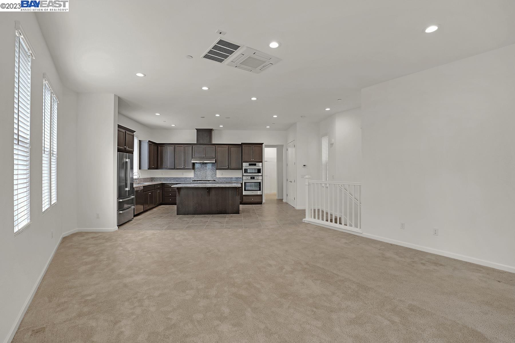 5772 Barley Road Dublin, CA 94568 - Photo 16 of 56 a kitchen with kitchen island sink and cabinets