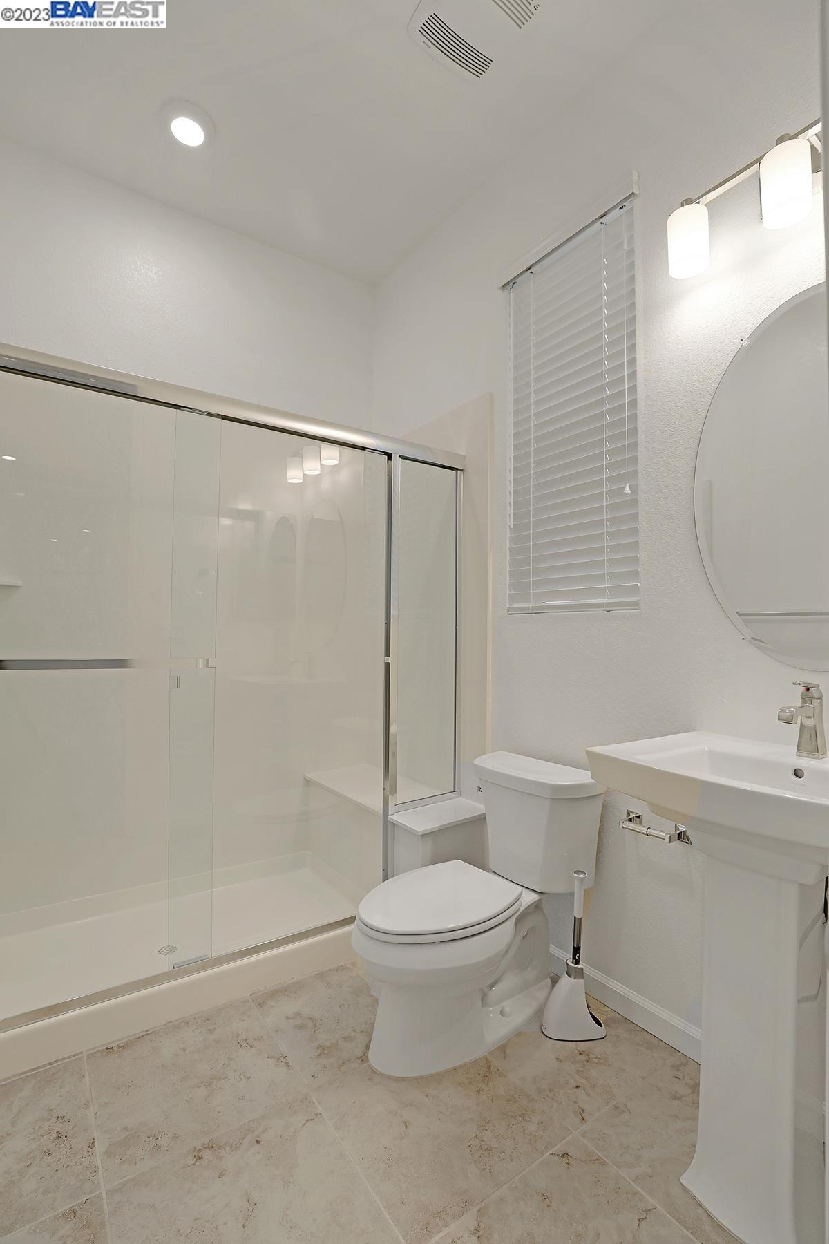 5772 Barley Road Dublin, CA 94568 - Photo 21 of 56 a bathroom with a toilet sink and a shower