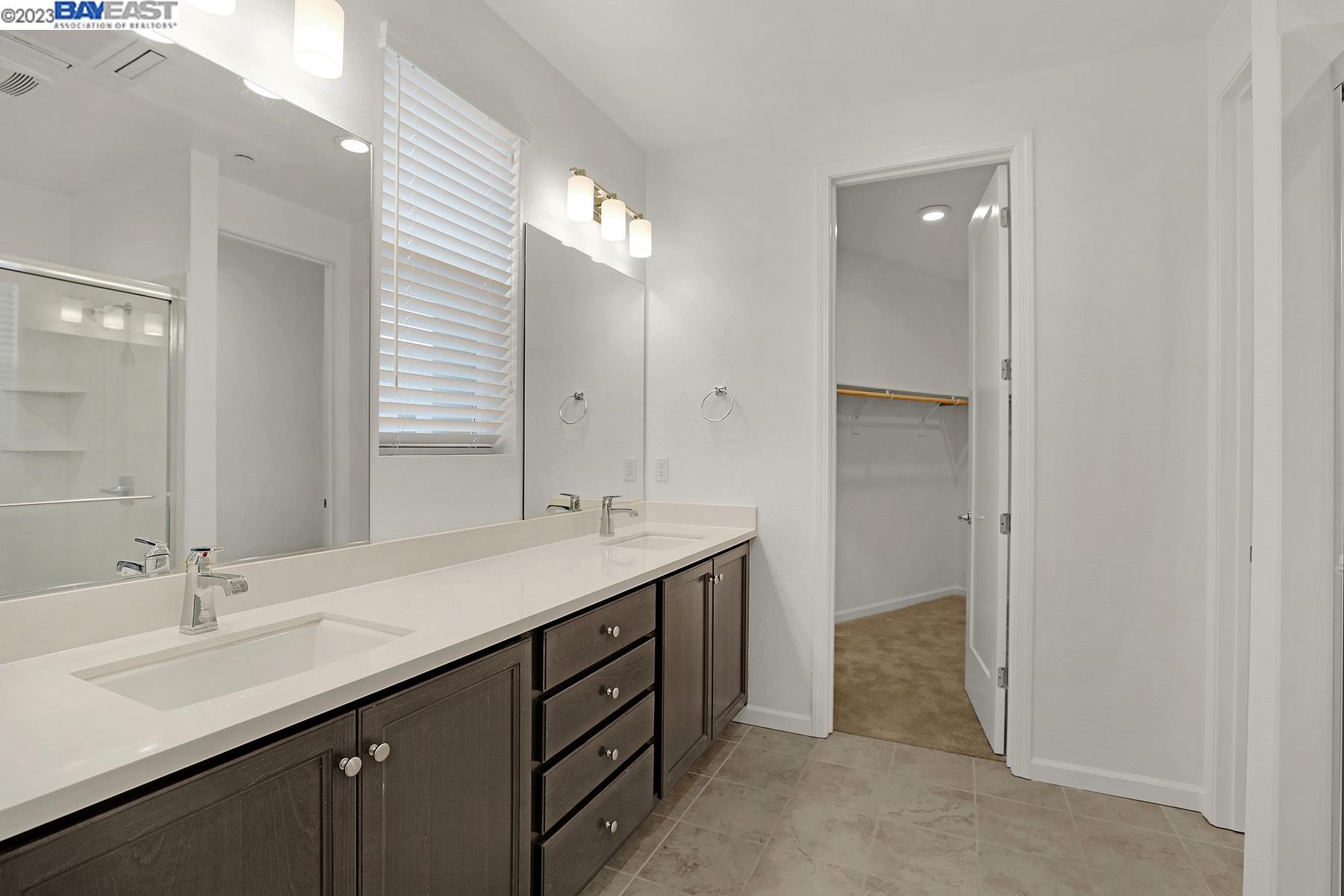 5772 Barley Road Dublin, CA 94568 - Photo 26 of 56 a bathroom with a sink double vanity and a mirror