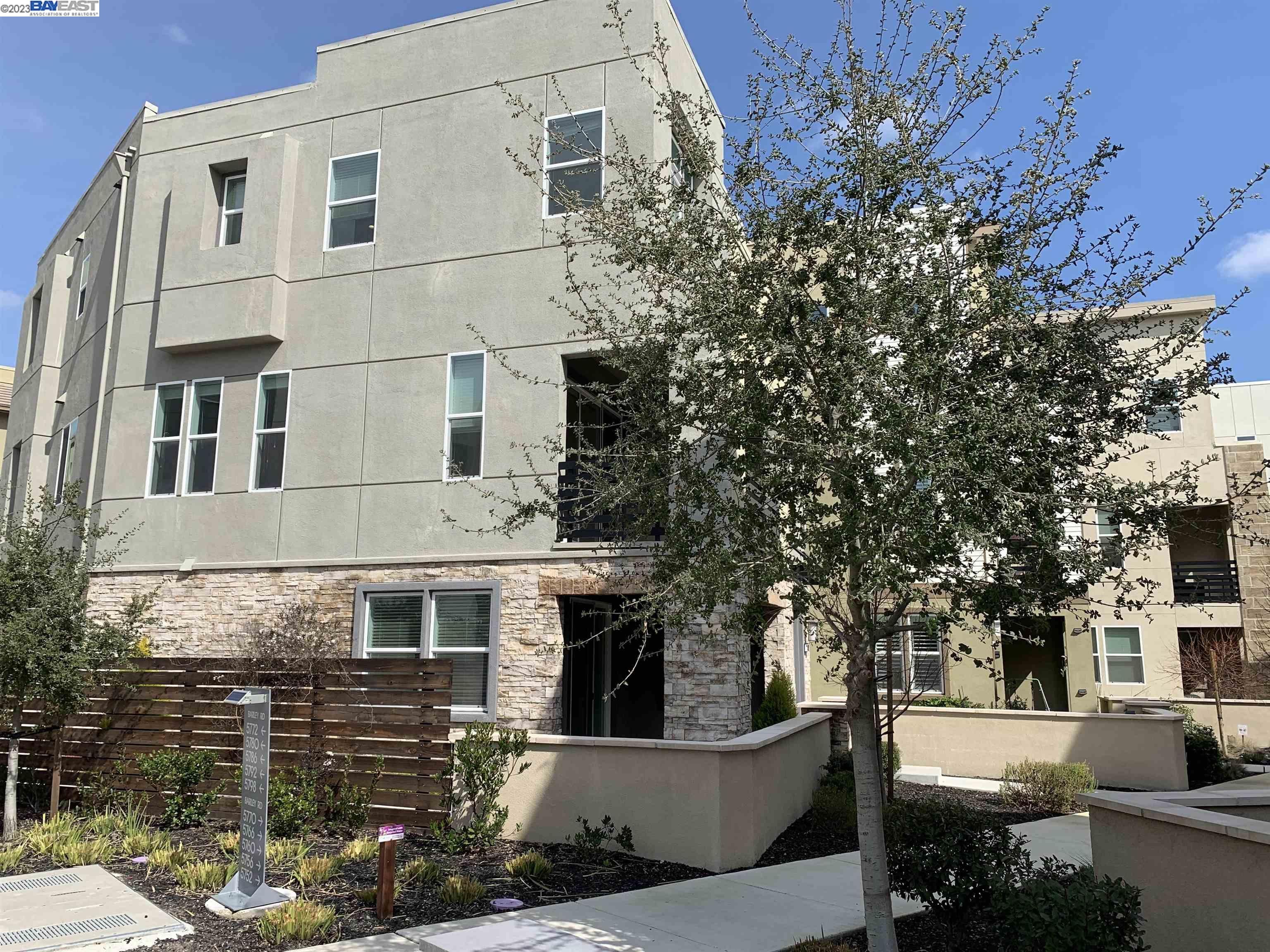 5772 Barley Road Dublin, CA 94568 - Photo 44 of 56 a view of a white building among the street with palm trees