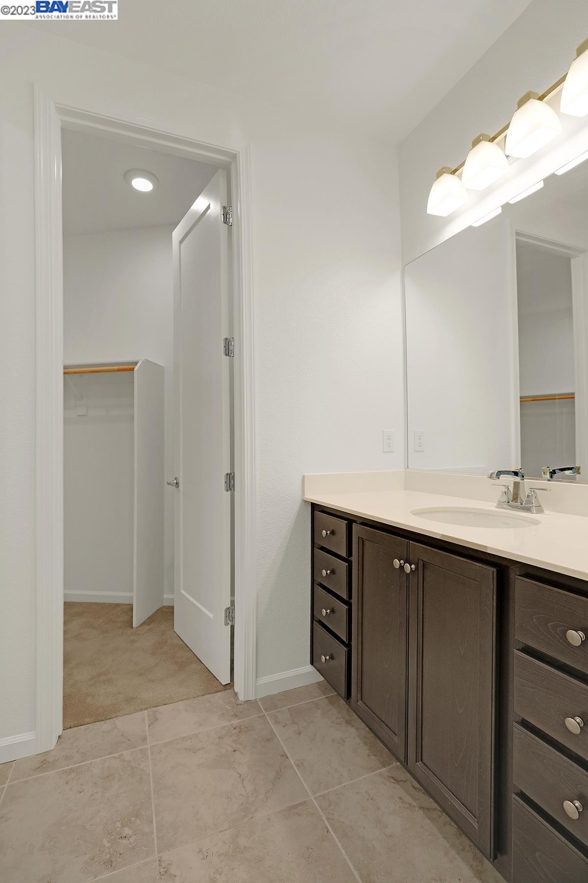 5772 Barley Road Dublin, CA 94568 - Photo 7 of 56 a bathroom with a double vanity sink mirror and shower