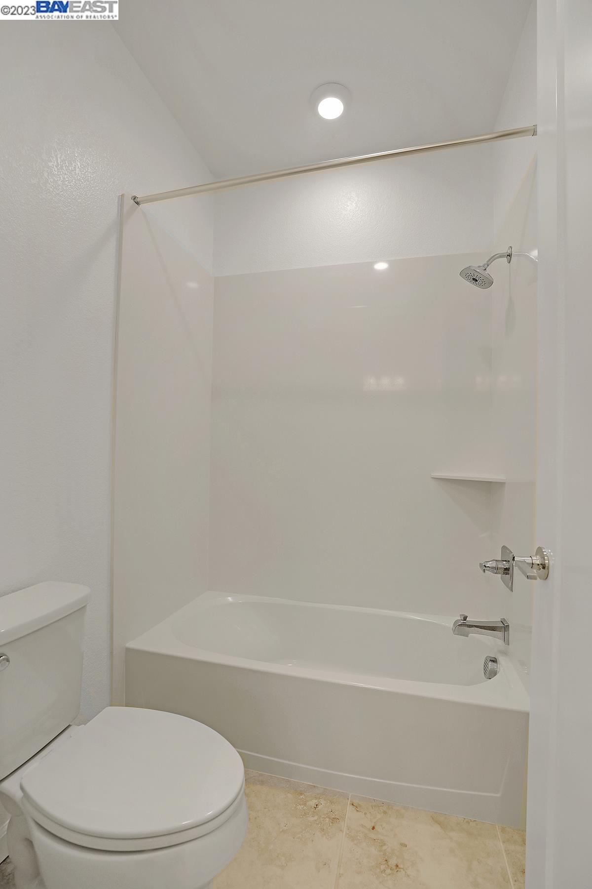 5772 Barley Road Dublin, CA 94568 - Photo 8 of 56 a bathroom with a toilet and a bathtub