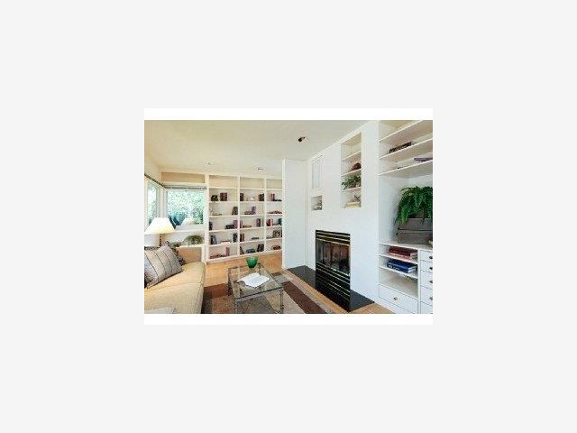 185 Phillip Road Woodside, CA 94062 - Photo 5 of 9 a living room with furniture a fireplace and a flat screen tv