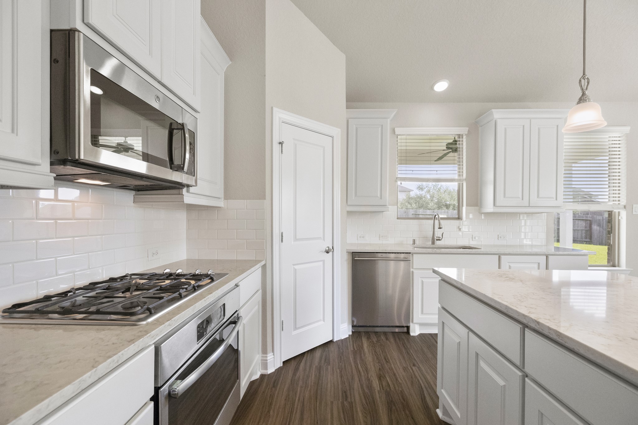 7502 Windsor Park Court Spring, TX 77379 - Photo 15 of 50 a kitchen with stainless steel appliances a sink a stove and cabinets