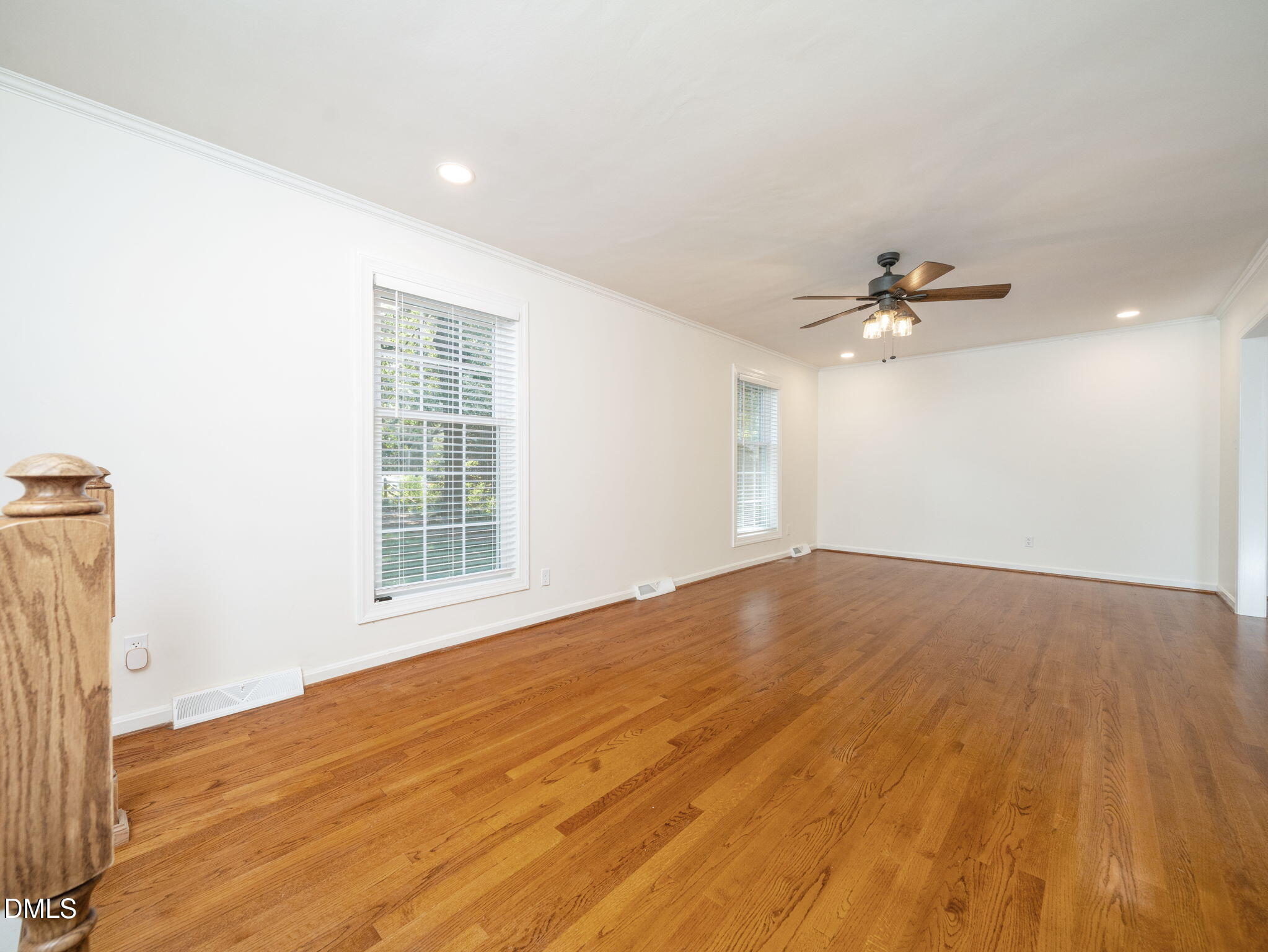 705 Villawood Court Raleigh, NC 27615 - Photo 6 of 31 The formal living room is ready for your furnishings and boasts lovely hardwood flooring.