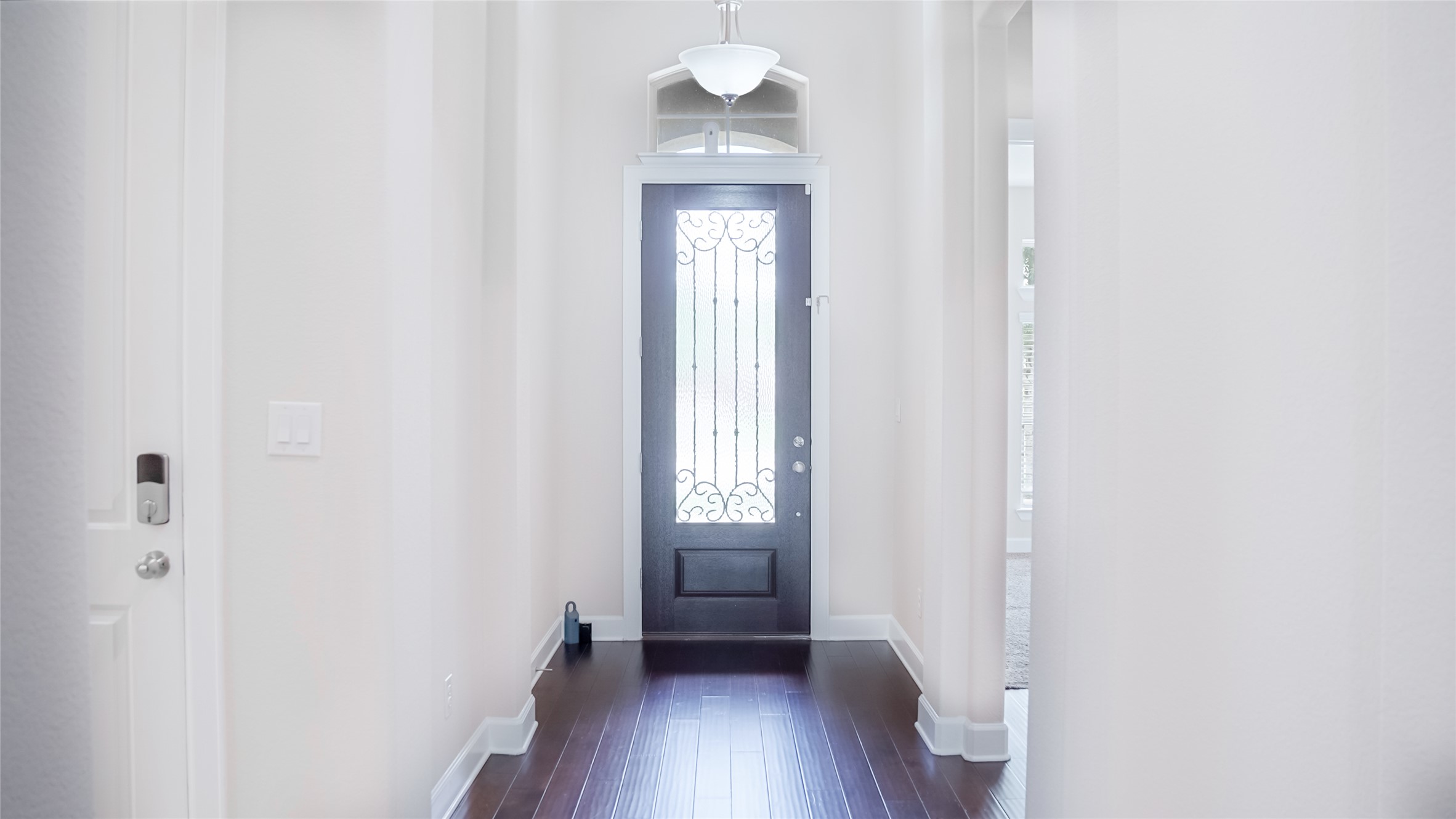 184 Fort Cobb Way Georgetown, TX 78628 - Photo 5 of 33 a view of a hallway with wooden floor and a window