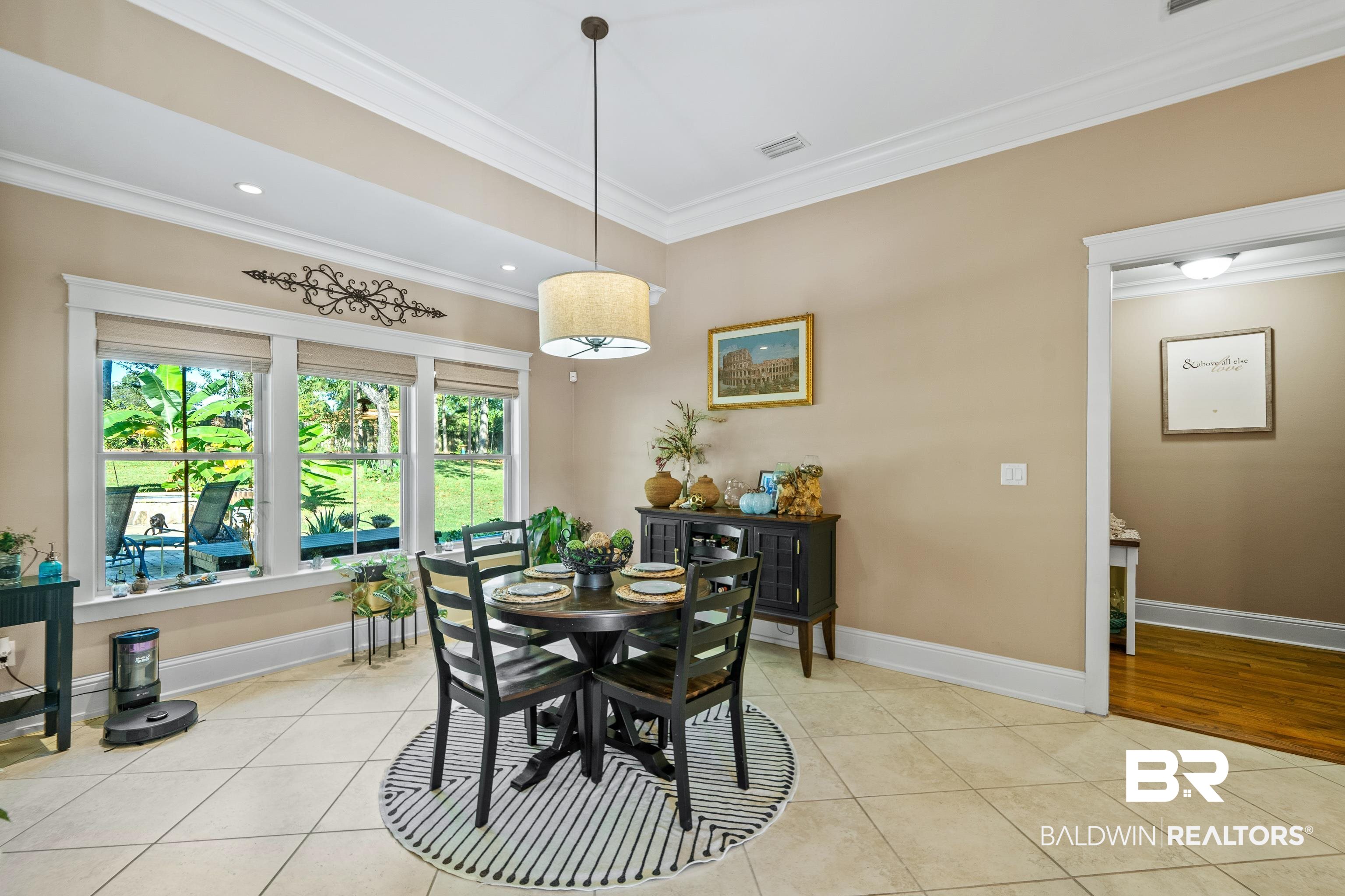 31829 Butler Drive Daphne, AL 36527 - Photo 19 of 48 Tiled dining space with crown molding