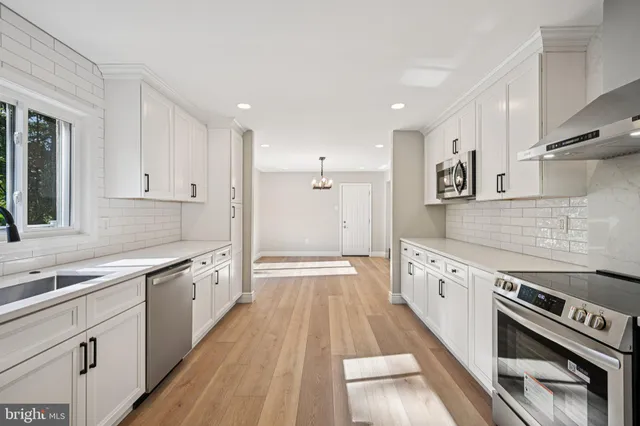 a kitchen with granite countertop a sink and cabinets