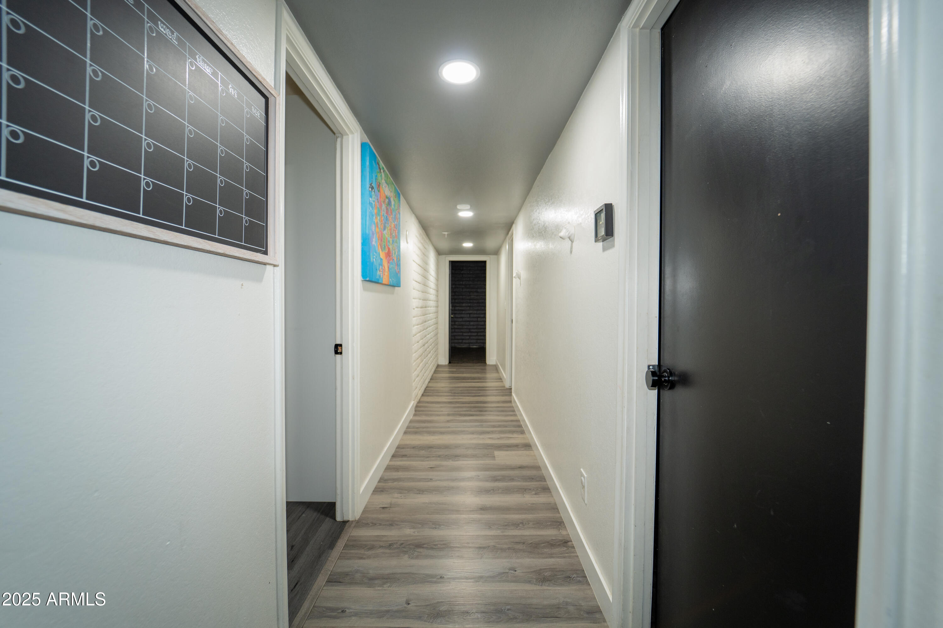 3102 West Paradise Drive Phoenix, AZ 85029 - Photo 11 of 22 a view of a hallway with wooden floor and staircase