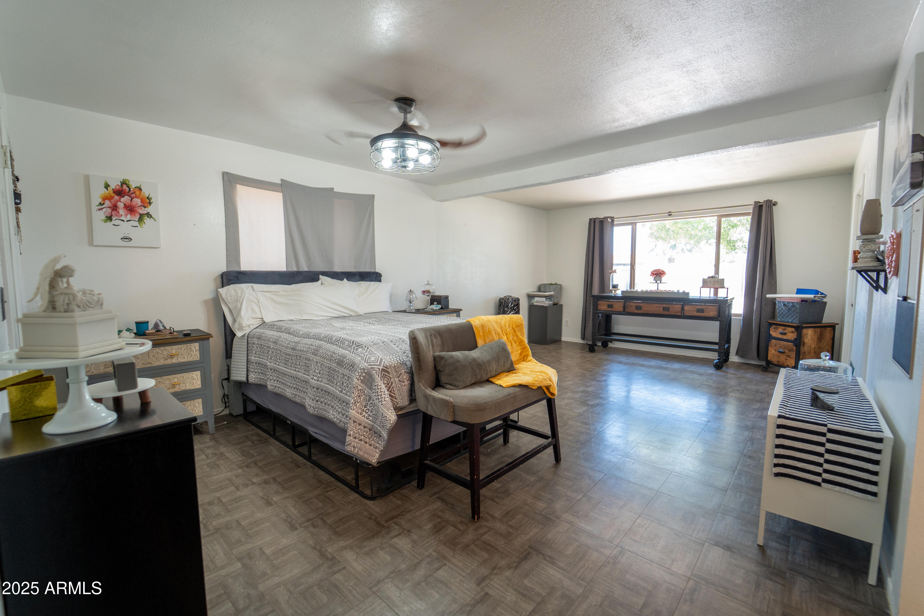 3102 West Paradise Drive Phoenix, AZ 85029 - Photo 12 of 22 a bedroom with a bed and wooden floor
