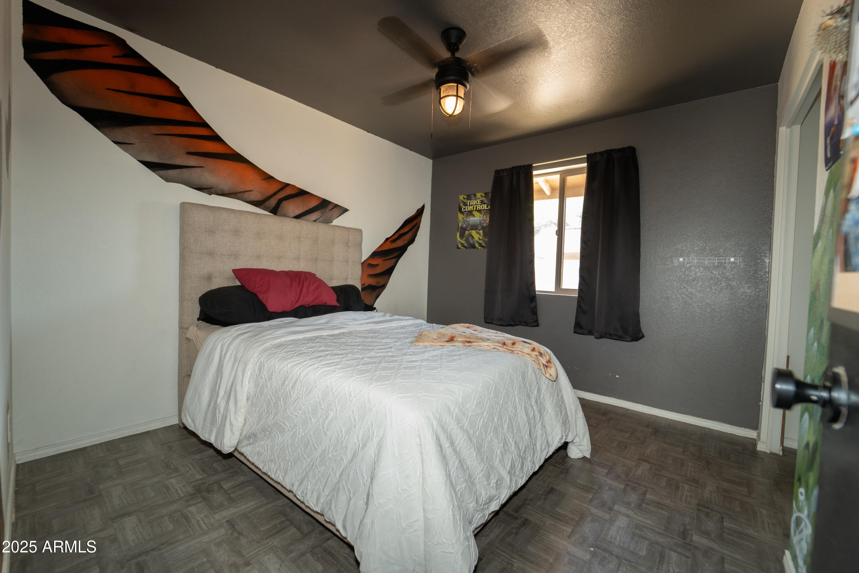 3102 West Paradise Drive Phoenix, AZ 85029 - Photo 16 of 22 a bedroom with a bed and a chandelier